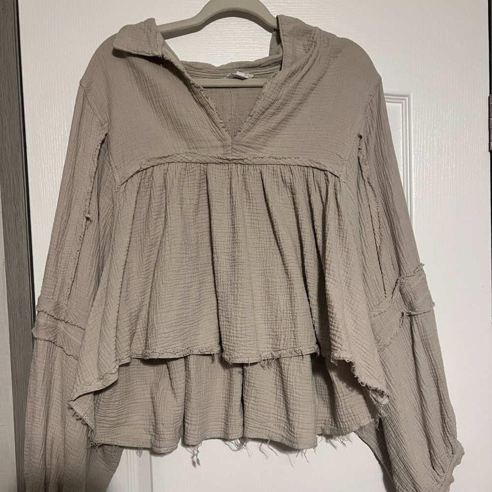 Cream long sleeved blouse